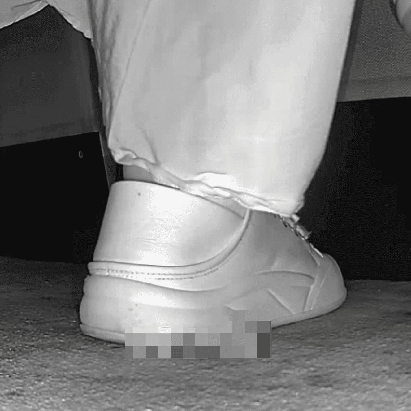 Woman in skirt and white sneakers candid crushing in the cinema